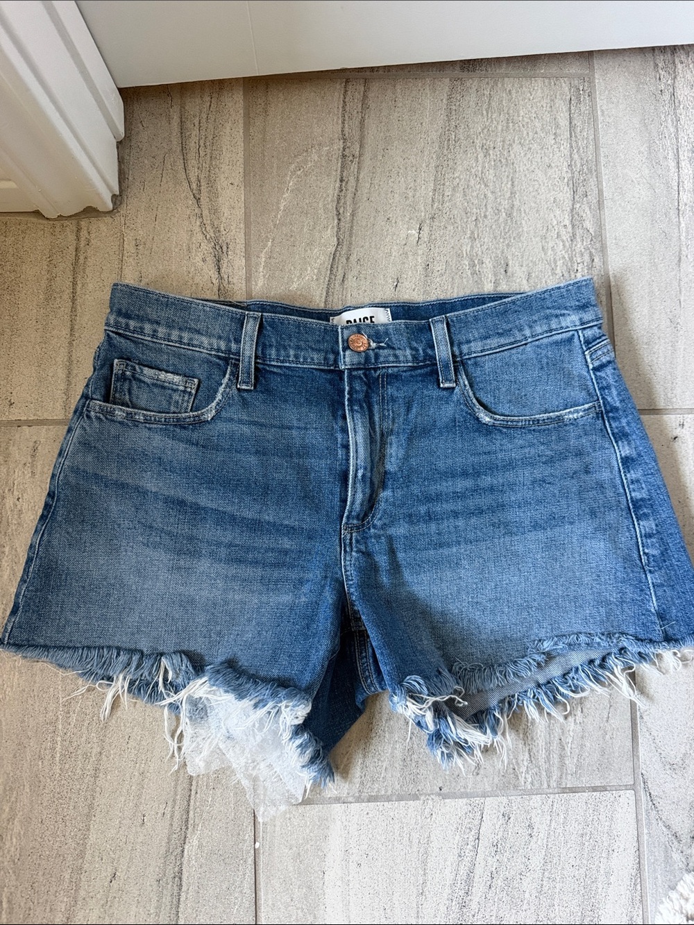 Paige Medium Blue Distressed Denim Cutoff Shorts